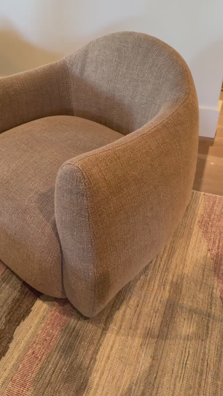 A delightfully, unexpected shape -- the Mina Swivel Chair is an Amethyst favorite.  It's gently curves define a space. Amethyst Home provides interior design, new home construction design consulting, vintage area rugs, and lighting in the Winter Garden metro area.