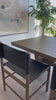 Solid parawood forms a simple, vintage-inspired frame for sling-style seating of chocolate top-grain leather. Amethyst Home provides interior design, new home construction design consulting, vintage area rugs, and lighting in the San Diego metro area.