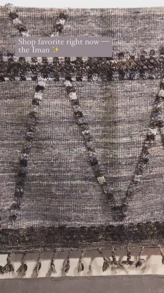 A new take on Moroccan style rugs, the Iman Collection is hand-knotted of 100% wool pile by skilled artisans in India. The surface features linear and braided details, creating tonal variations that make each piece unique. Plus, each design is finished with playful fringe.  Hand Knotted 100% Wool Pile IMA-04 Grey / Multi