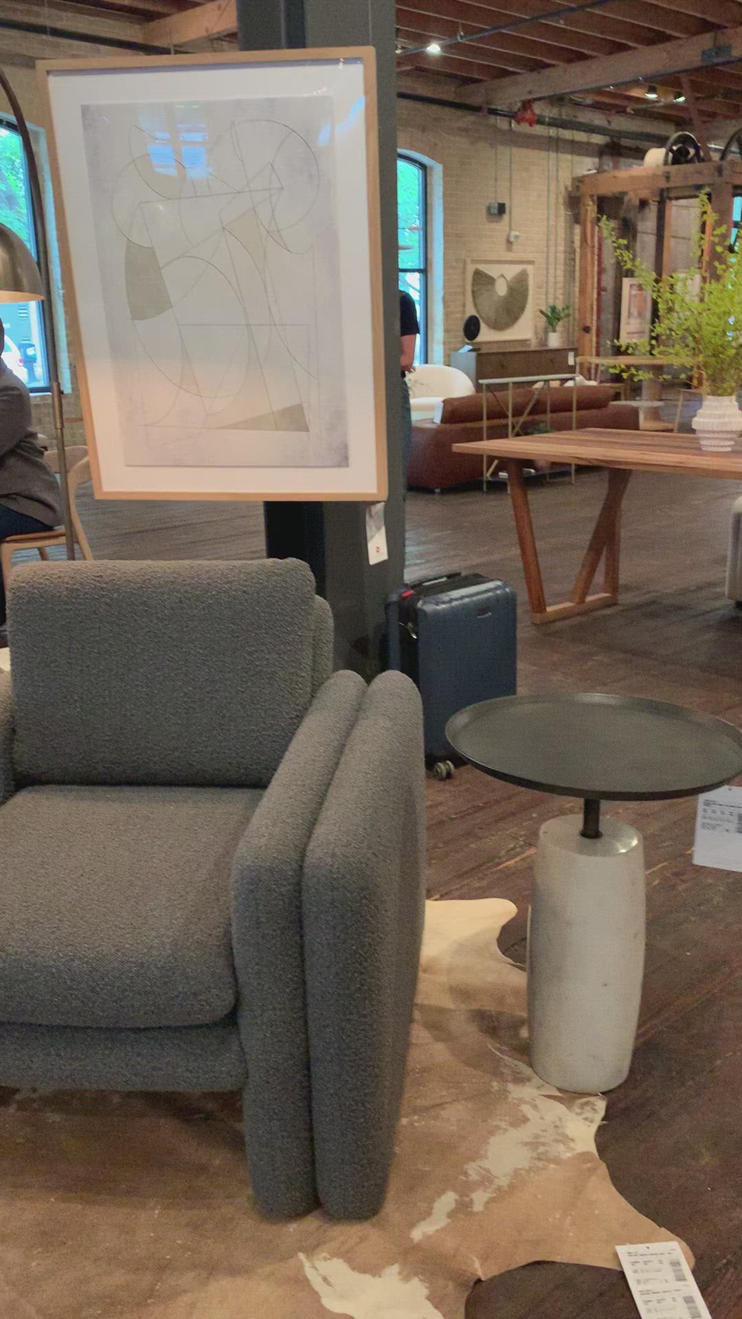 Load video: Simply sophisticated with this Cronos End Table - Polished White Marble. Finished in a polished white, a solid turned marble base supports a tray-style tabletop of grey-hammered iron, spurring beautifully eye-catching contrast for any living room or bedroom.   Overall Dimensions: 19.75&quot;w x 19.75&quot;d x 24.75&quot;h