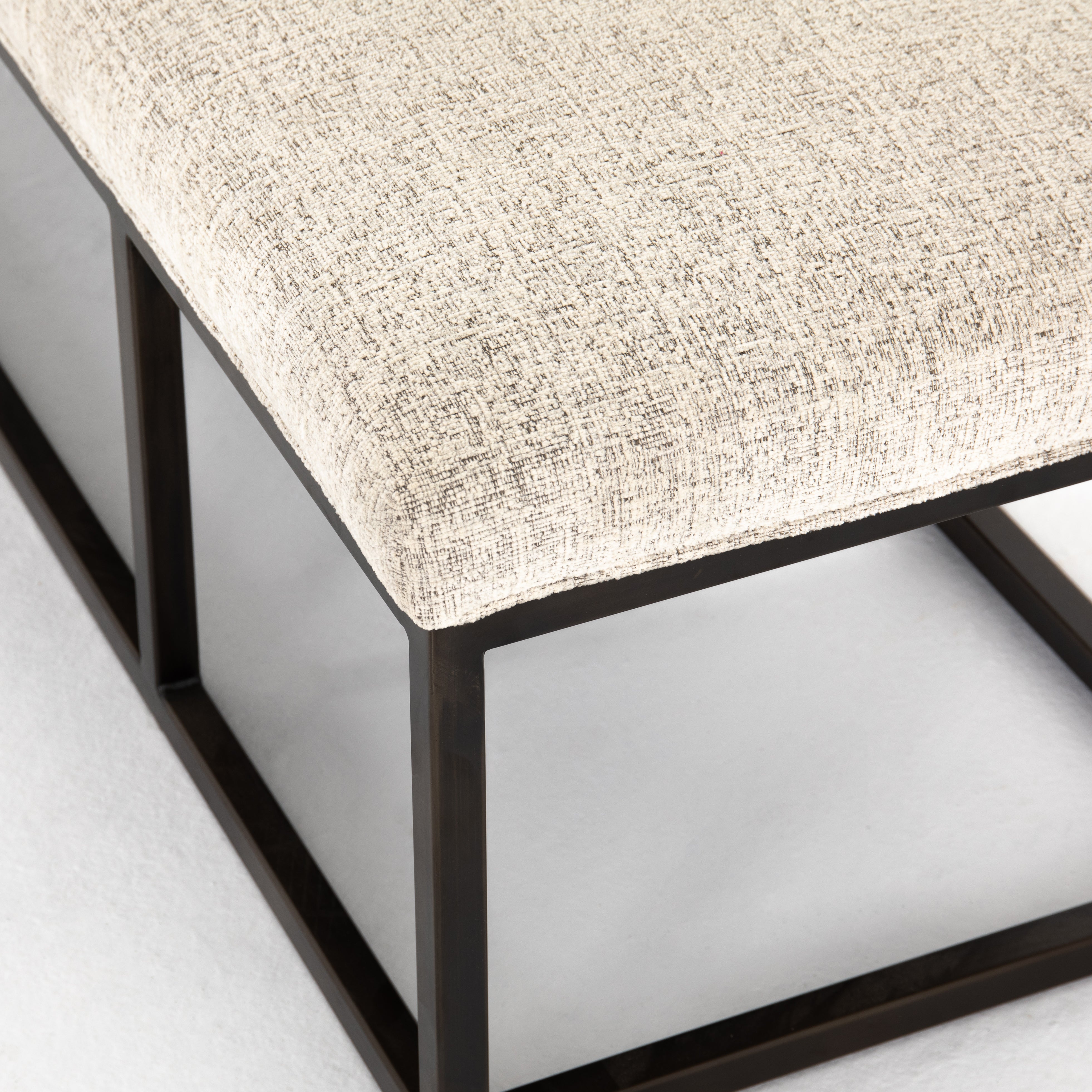 The Beaumont Plushtone Linen Bench has streamlined shaping and is textural to the touch. Gunmetal-finished iron framing stands slim and structured to support a well-tailored top of plush, linen-like upholstery. Open, adaptable styling allows for versatile placement options.  Size: 72"w x 20"d x 17"h