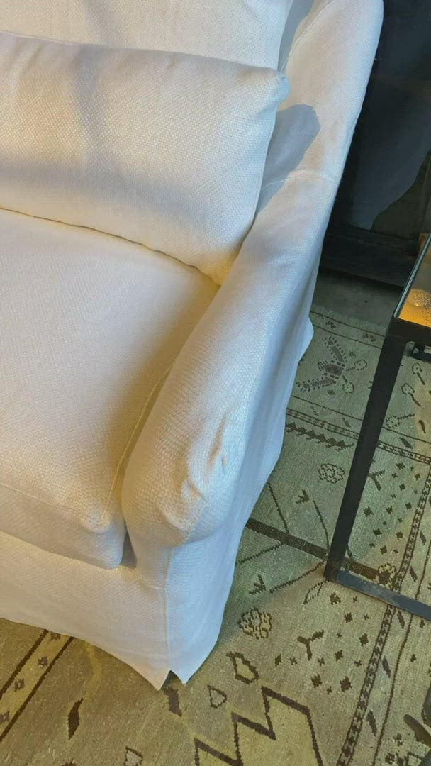 Load video: This charming Genevieve Sofa Family has a distinctive look that will elevate your space with a touch of whimsy. With two-over-two cushions and lumbar pillows, the Genevieve perfectly blends style and comfort in your home. Photographed in Brevard Ivory.
