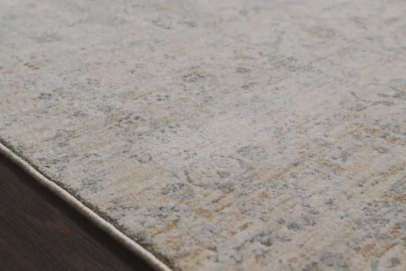 Load video: Our updated take on a classic. The Pandora Ivory/Mist Rug is power-loomed of 100% polyester, ensuring long-lasting durability, no shedding, and a soft feel underfoot.  The pile features a high to low texture, accentuating these timeless yet current designs. This rug is great for living rooms, bedrooms, or any room where you want cozy and comfortable texture on the floor!  Power Loomed 100% Polyester PAN-02 Ivory/Mist