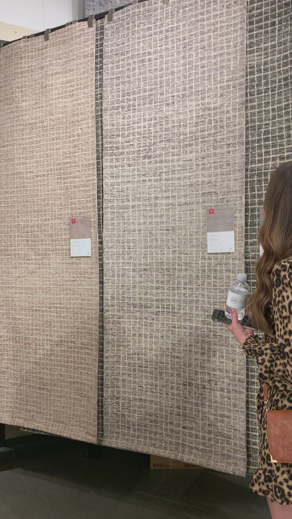 Inspired by textural watercolors, the Giana Smoke Area Rug combines a relaxed grid with soft variations of smokey creams for an effortless and sophisticated look. Each area rug is hooked of 100% wool by artisans for a beautiful textural layer to your home. The soft textures of this area rug bring warmth and coziness to any room.  Hooked 100% Wool GH-01 Smoke
