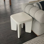 A minimalist dream, this Dante End Table - White Concrete is made from white-finished cast concrete with soft, chunky proportions. This would elevate the space for any living room or lounge area.    Overall Dimensions: 19.00"w x 19.00"d x 19.00"h
