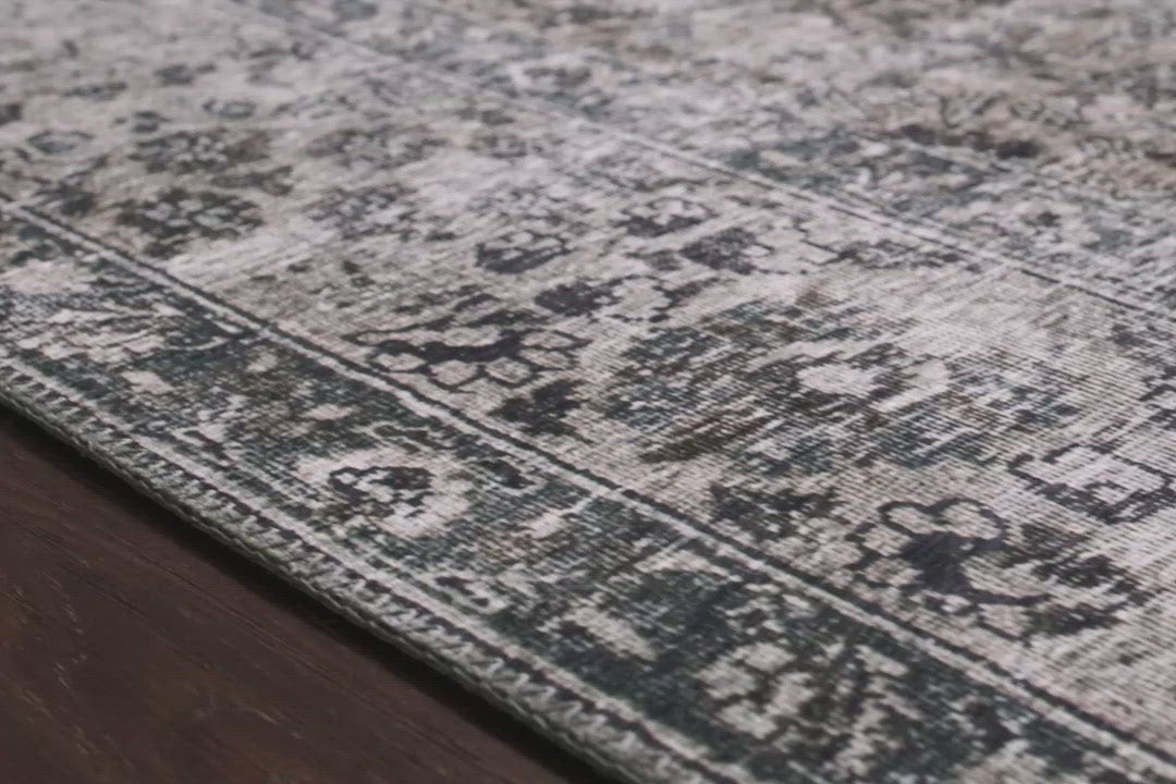 The Layla Collection is traditional and timeless, with a beautiful lived-in design that captures the spirit of an old-world rug. This traditional power-loomed rug is crafted of 100% polyester with a classic and sophisticated color palette and subtle patina.  Power Loomed 100% Polyester LAY-06 Taupe/Stone