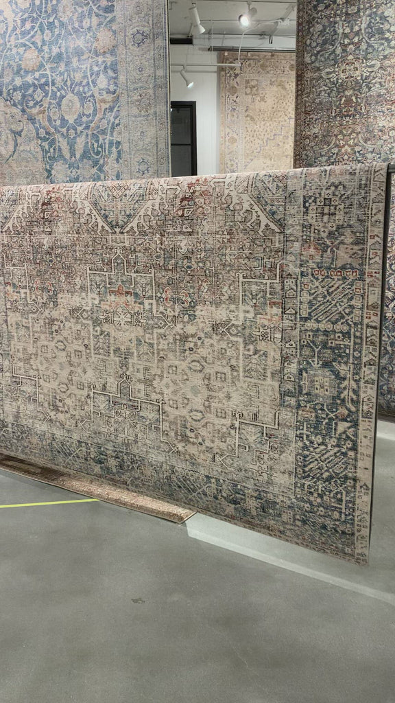 Durable, low pile, and soft underfoot, this rug is inspired by classic vintage and antique rugs. The Jules Chris Loves Julia Natural / Ocean JUL-07 rug from Loloi features a beautiful vintage pattern and patina. The rug is easy to clean and maintain and perfect for living rooms, dining rooms, hallways, and kitchens!