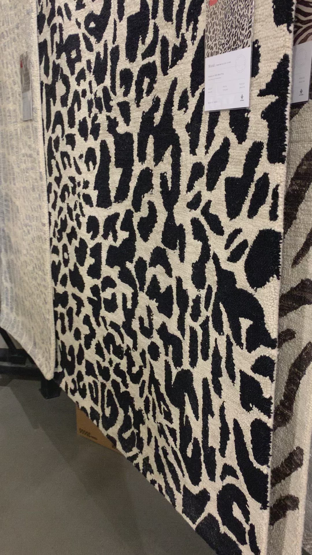 Hooked of 100% wool, this Masai Collection is a softer side of the savannah brought to life by artisans in India. Masai is a beautiful contemporary rug with contrasting hues and is a chic twist on the classic animal print.  Hooked 100% Wool MAS-02 Black / Ivory