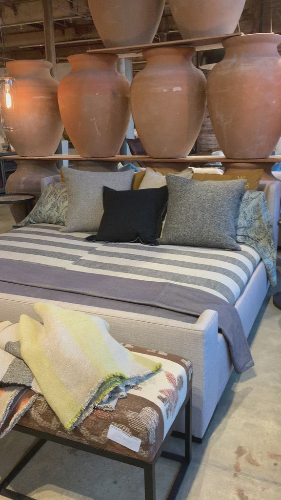 We love the maple wood base of this Laurel Bed by Cisco Brothers. A cozy, chic piece to add to your bedroom to immediately elevate the space. Photographed in Molino Blush. Amethyst Home provides interior design, new home construction design consulting, vintage area rugs, and lighting in the Winter Garden metro area.