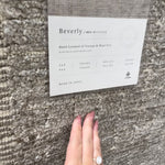 Modern and refined, the Beverly Stone rug by Loloi is hand-loomed by master artisans of viscose and wool pile. Clean lines and minimalist hues allow you to layer Beverly into any room.  Hand Loomed 45% Viscose | 26% Wool | 20% Cotton | 7% Polyester | 2% Other Fibers BEV-01 Stone