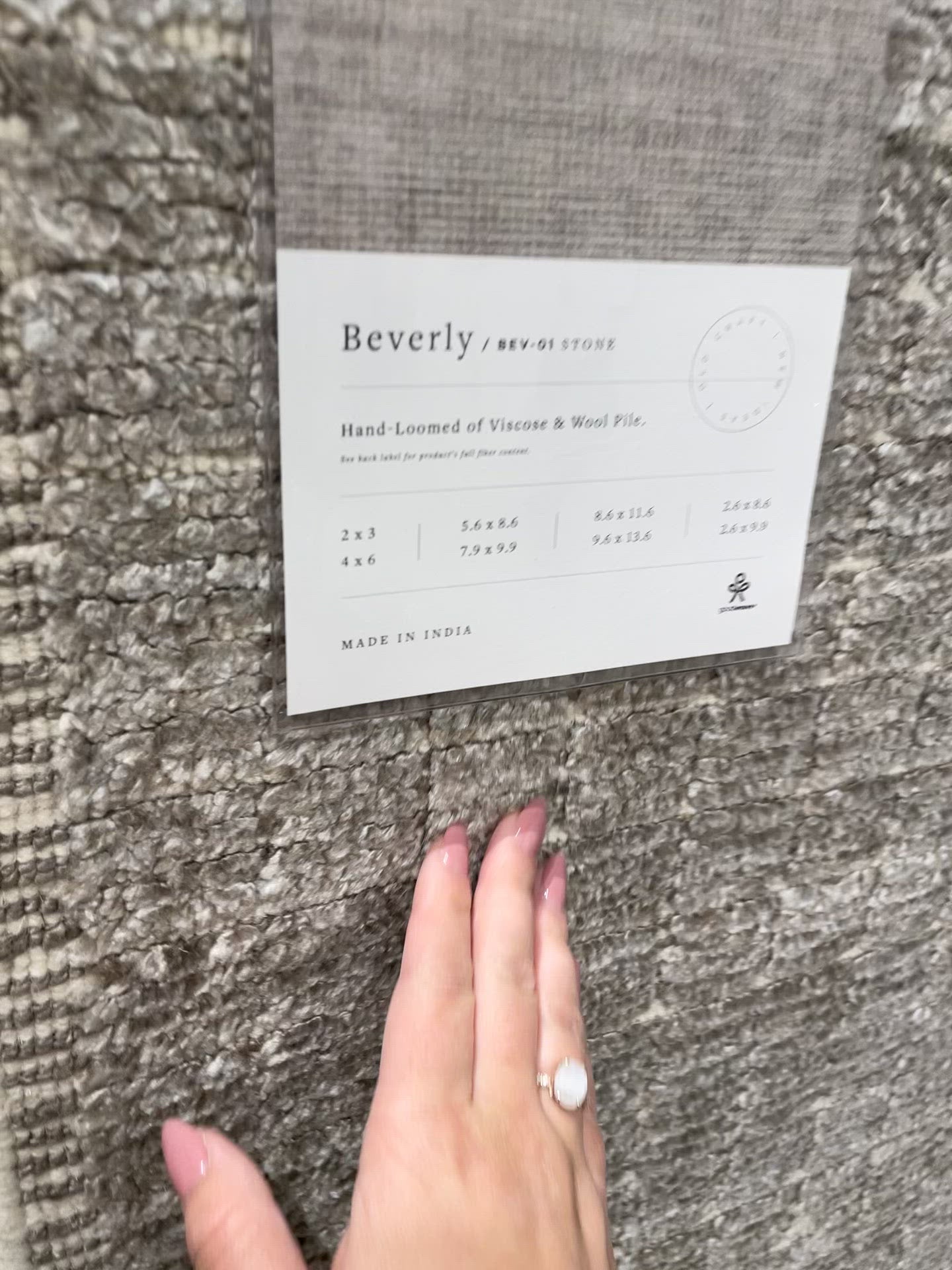 Load video: Modern and refined, the Beverly Stone rug by Loloi is hand-loomed by master artisans of viscose and wool pile. Clean lines and minimalist hues allow you to layer Beverly into any room.  Hand Loomed 45% Viscose | 26% Wool | 20% Cotton | 7% Polyester | 2% Other Fibers BEV-01 Stone