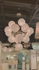 We love the white strie glass globes on this Cristol Large Chandelier by Visual Comfort. It brings a stunning and unique look to any living room, dining room, or kitchen.  Designer: AERIN