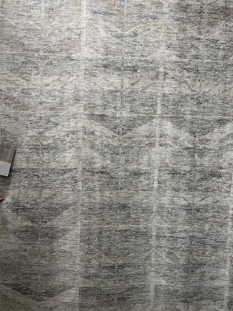Drawing inspiration from tribal influences, the Odyssey Neutral Area Rug combines relaxed linear pattern with a sophisticated color palette. Each Odyssey area rug, which is hand knotted of wool, viscose, and cotton, is crafted entirely by hand by master artisans in India. A beautiful choice for a living room, entryway, or other high traffic area.   Hand Knotted 60% Wool | 30% Viscose | 10% Cotton OD-05 Netural