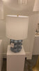 We love the form shape of this Vedra Medium Table Lamp. The dimmer feature makes it a perfect choice for your bedroom, living room, or other area that is perfect for setting the mood.   Reactive Ceramic Glazes Will Vary in Color and Texture  Designer: AERIN
