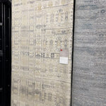 The Idris Ivory/Taupe area rug from Loloi is meticulously hand-knotted of viscose and wool. You will love this rug because the rug is:  Perfect for entryways, living rooms, and bedrooms Easy to clean and maintain Gorgeous with the intricate pattern and patina Warms up any room with the high / low pile Hand-Knotted 70% Viscose | 30% Wool ID-04 Ivory/Taupe