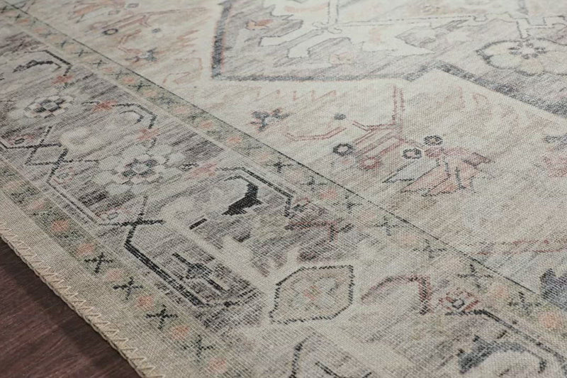 Featuring soft motifs in a carefully curated color palate of ivory, blue, green, and hints of purple, the Hathaway Multi / Ivory area rug captures the essence of one-of-a-kind vintage or antique area rug at an attractive price.