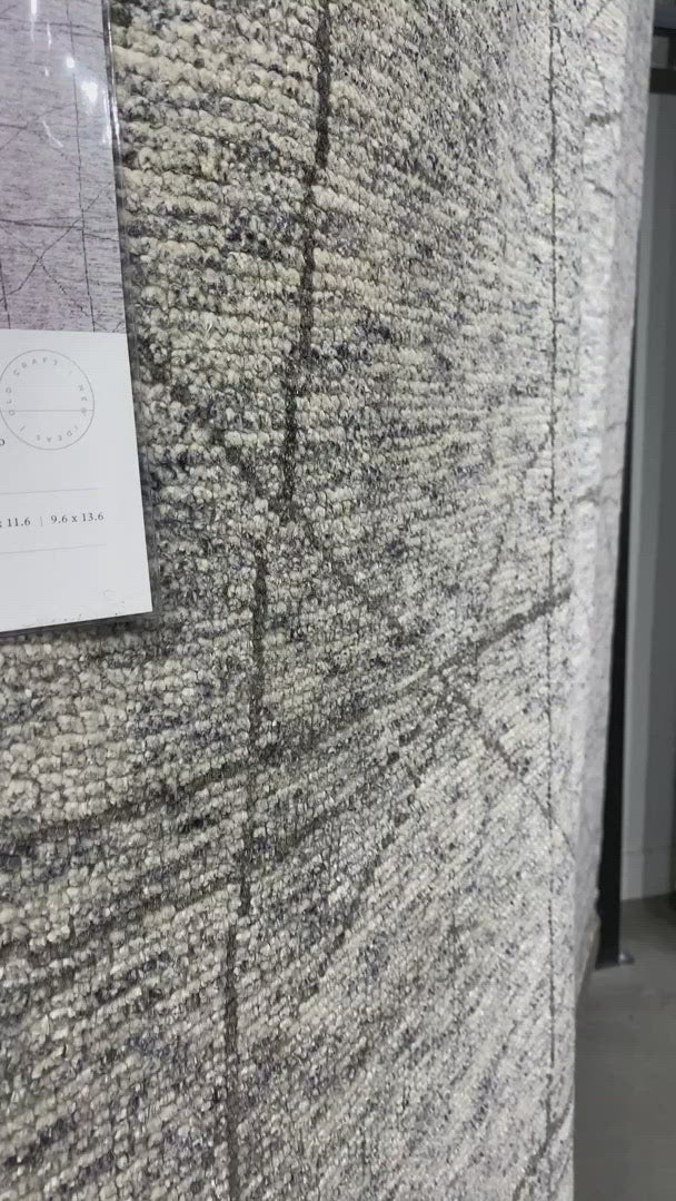 Drawing inspiration from tribal influences, the Odyssey Collection combines relaxed linear pattern with a sophisticated color palette. Each Odyssey rug, which is hand-knotted of wool and viscose from bamboo, is crafted entirely by hand by master artisans in India.  Hand Knotted 70% Viscose from Bamboo | 30% Wool OD-02 Slate/Grey