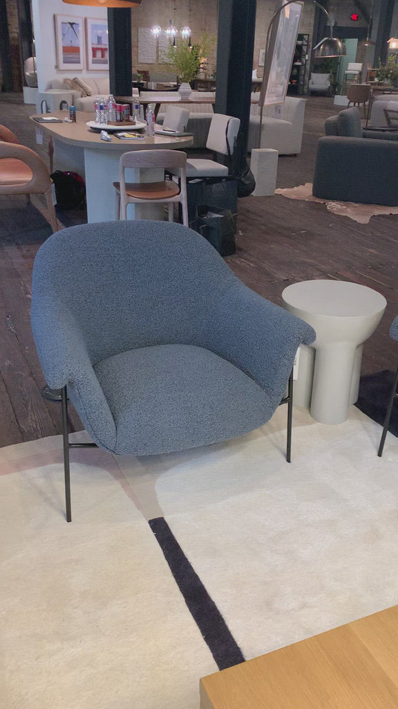 We love the curvy silhouette and classic rolled arms of this Suerte Chair - Knoll Sky. Sky-blue boucle lends a fresh feel to vintage-inspired accent seating for any living room, office, or other area.   Overall Dimensions: 35.00"w x 33.50"d x 31.00"h