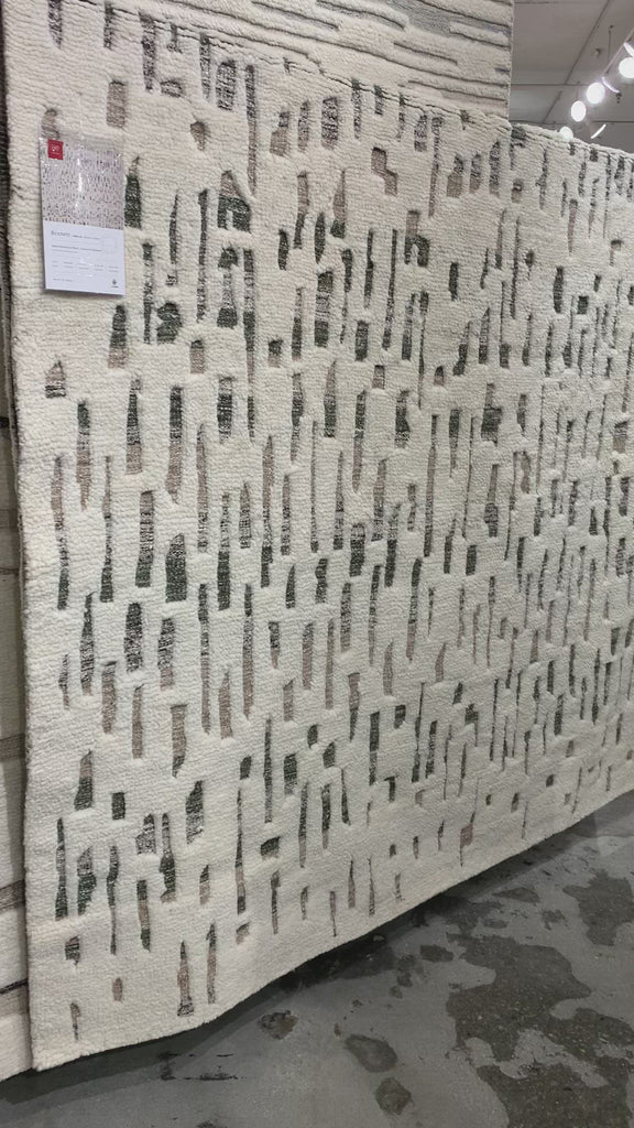 The Loloi Bennett Ivory / Forest Area Rug, or BEN-06, is hand-knotted of wool, viscose and polyester in India. Featuring a new carve like high-low pile, Bennett has an ivory base with abstract tonal designs. Plus, it's plush underfoot-- a great choice for your office, bedroom, or other medium traffic areas. 