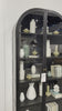 Store it in style with this Breya Cabinet in black. Made from black-finished iron, beautifully arched cabinetry features glass-front doors, ideal for storing and displaying favorite books, photos, keepsakes, and more. Amethyst Home provides interior design, new home construction design consulting, vintage area rugs, and lighting in the Washington metro area.