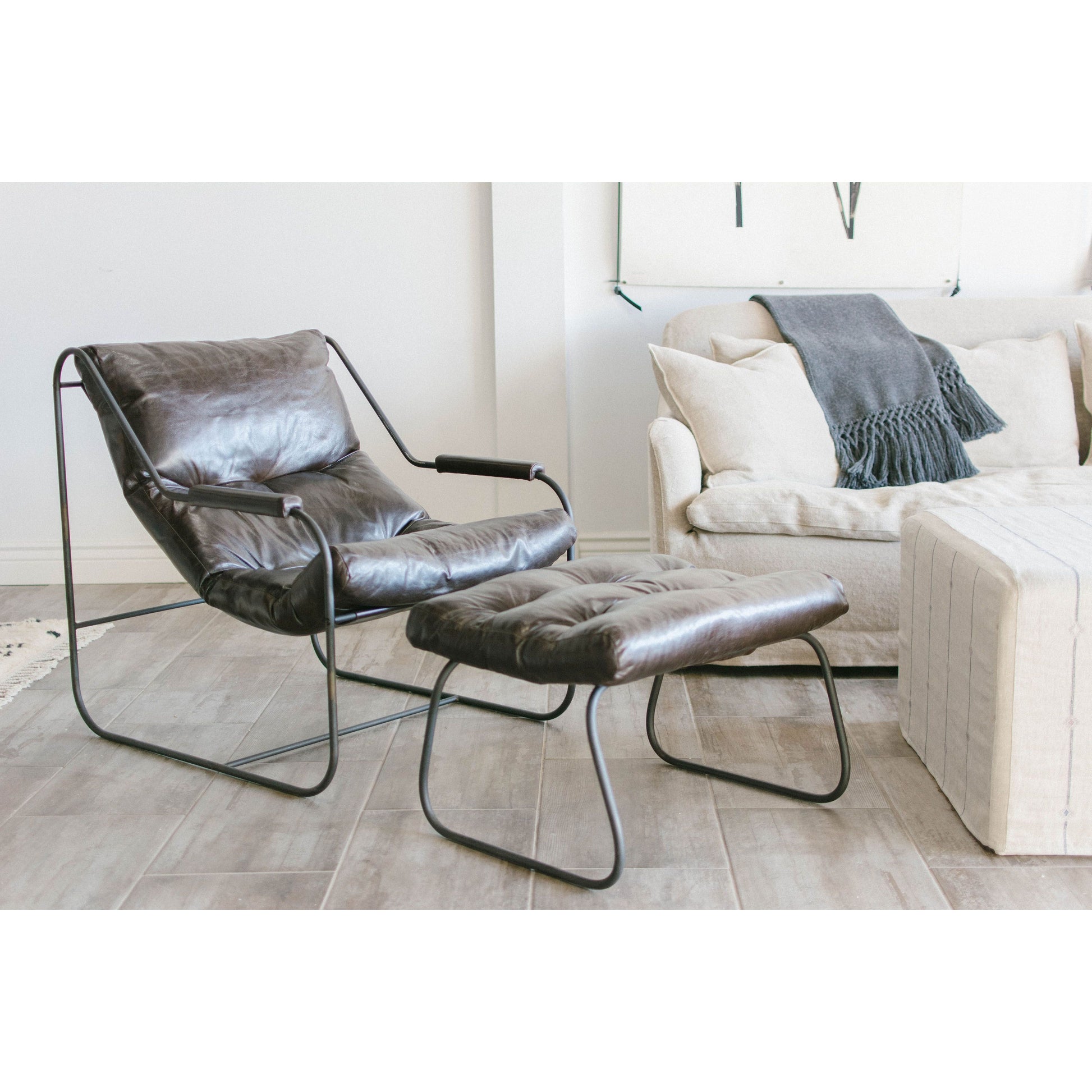 Like "sitting in an American baseball glove" -- the Brando Leather Chair Set from Cisco Brothers was love at first sit in this unique chair! We compare the feel to sitting in a hammock. As shown in Spur Terracotta leather.  Size: 27"w x 36"d x 32"h Seat space: 25"w x 19"d x 17.5"h Ottoman: 25"w x 20"d x 16.5"h