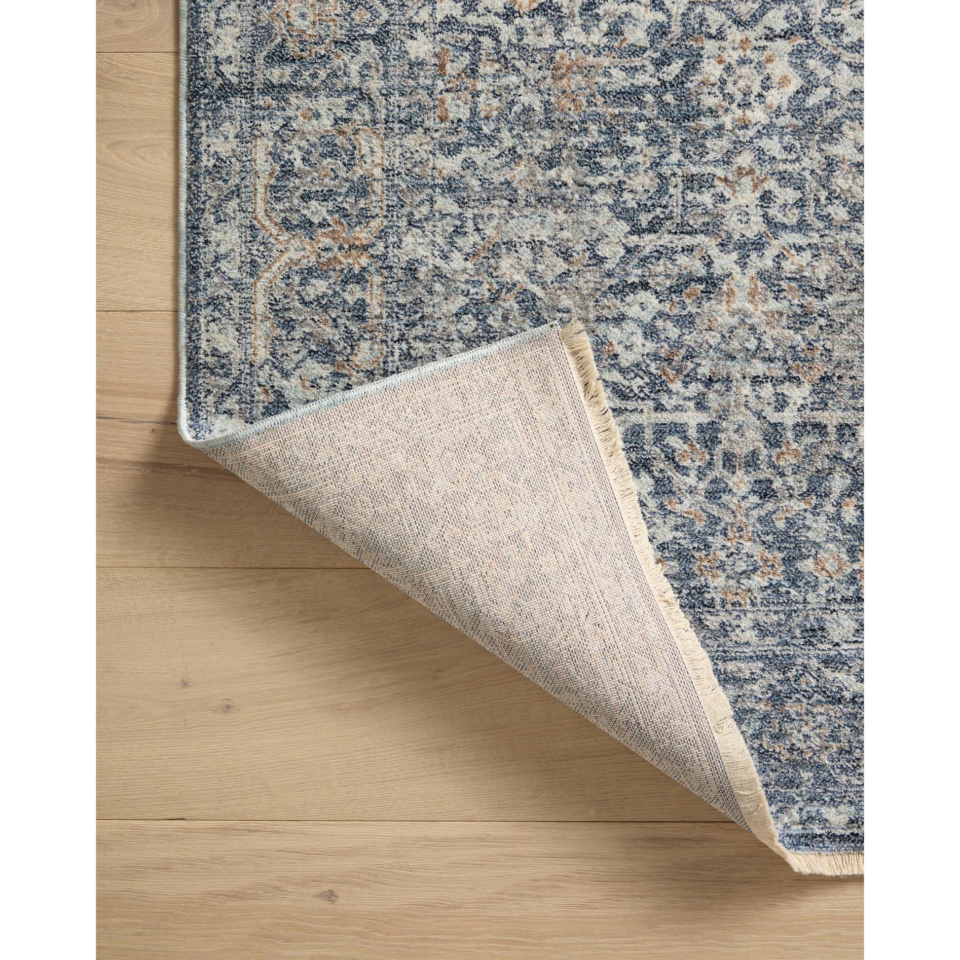 The Angela Rose x Loloi Blake BLA-03 Denim / Taupe rug features traditional motifs that have softened into the background, making it an effortless neutral in any room. Muted earth-toned palettes complement a range of furniture, while subtle cream-colored fringe at the edges add texture and framing. Amethyst favorite! Amethyst Home provides interior design services, furniture, rugs, and lighting in the Nashville metro area.