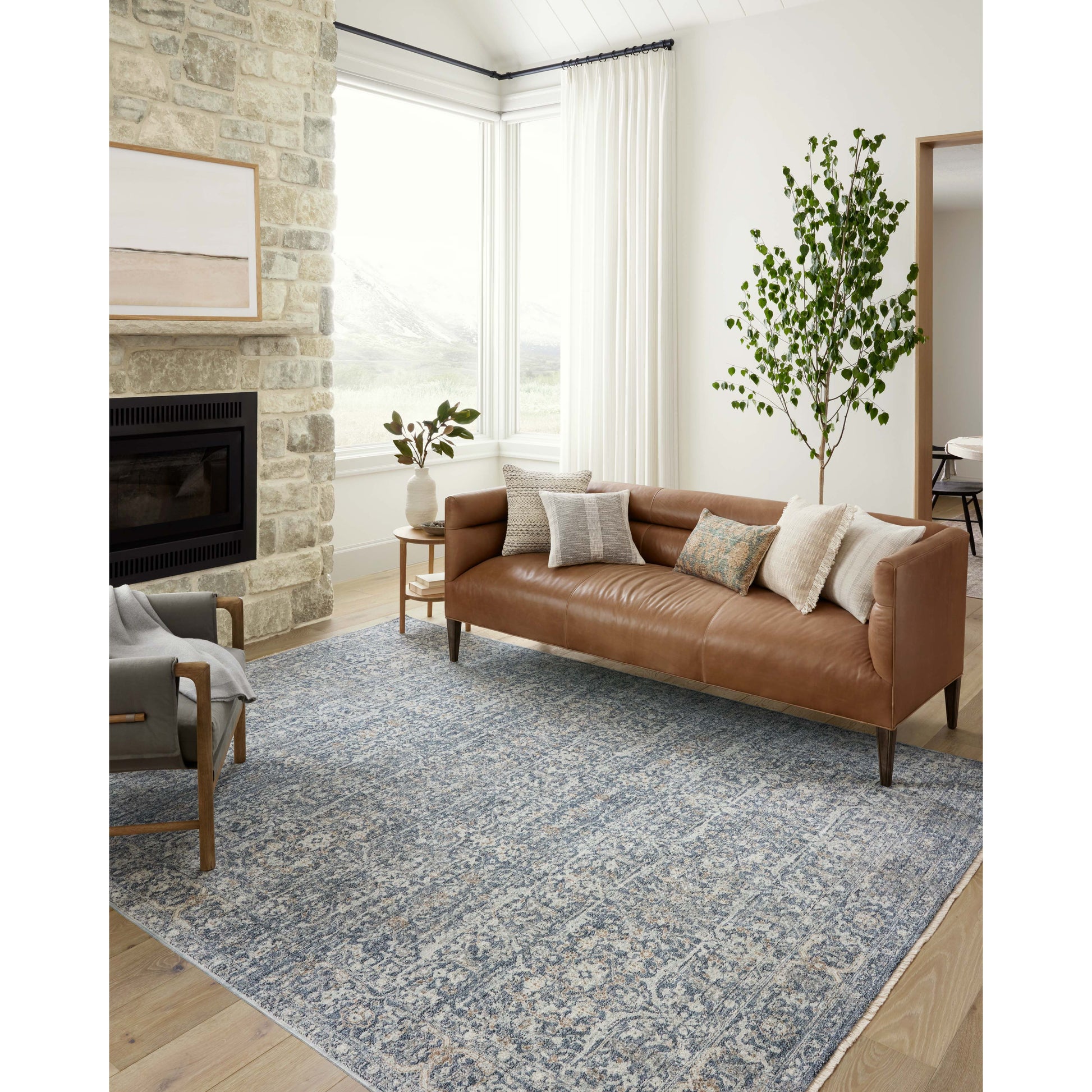 The Angela Rose x Loloi Blake BLA-03 Denim / Taupe rug features traditional motifs that have softened into the background, making it an effortless neutral in any room. Muted earth-toned palettes complement a range of furniture, while subtle cream-colored fringe at the edges add texture and framing. Amethyst favorite! Amethyst Home provides interior design services, furniture, rugs, and lighting in the Omaha metro area.