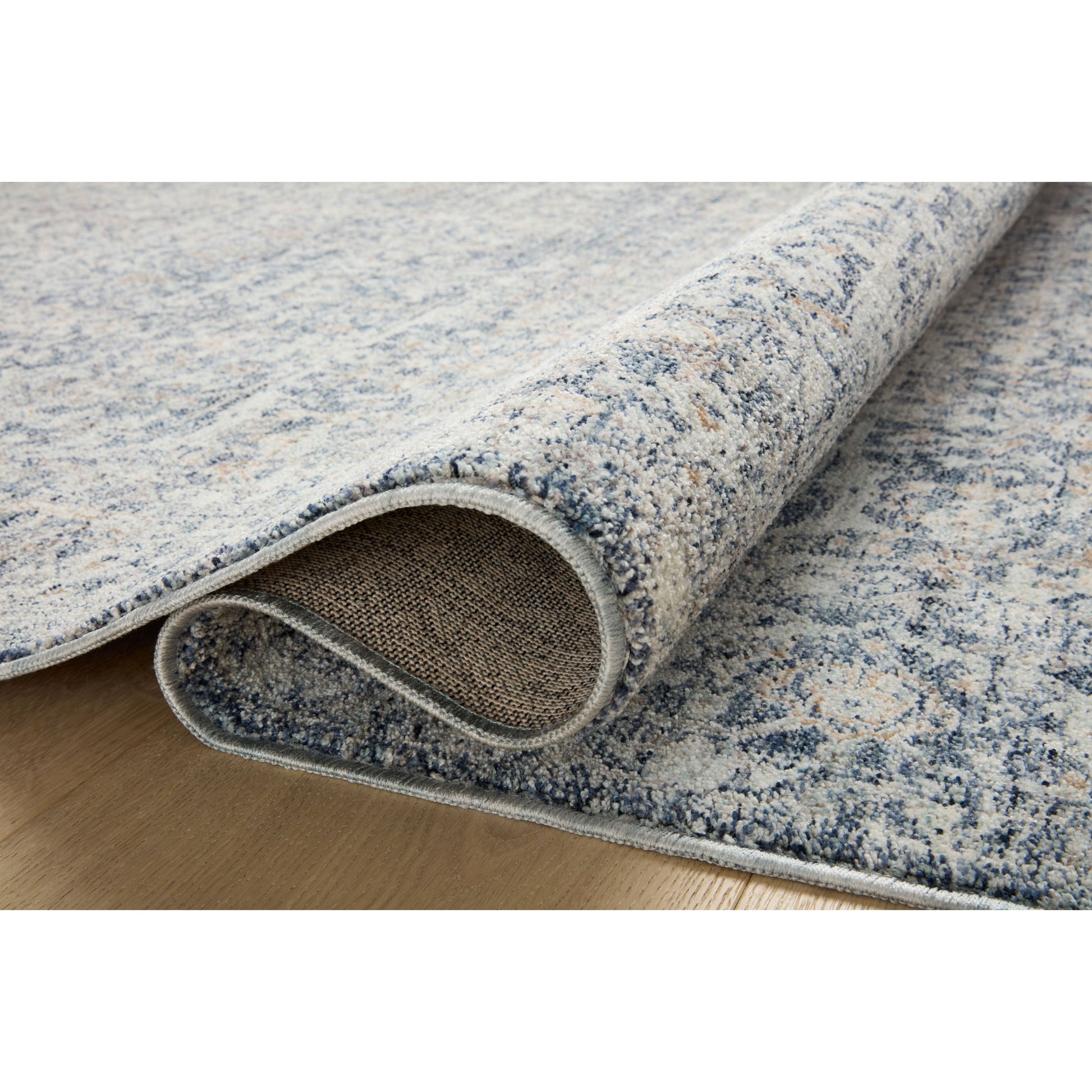 The Angela Rose x Loloi Blake BLA-03 Denim / Taupe rug features traditional motifs that have softened into the background, making it an effortless neutral in any room. Muted earth-toned palettes complement a range of furniture, while subtle cream-colored fringe at the edges add texture and framing. Amethyst favorite! Amethyst Home provides interior design services, furniture, rugs, and lighting in the Portland metro area.