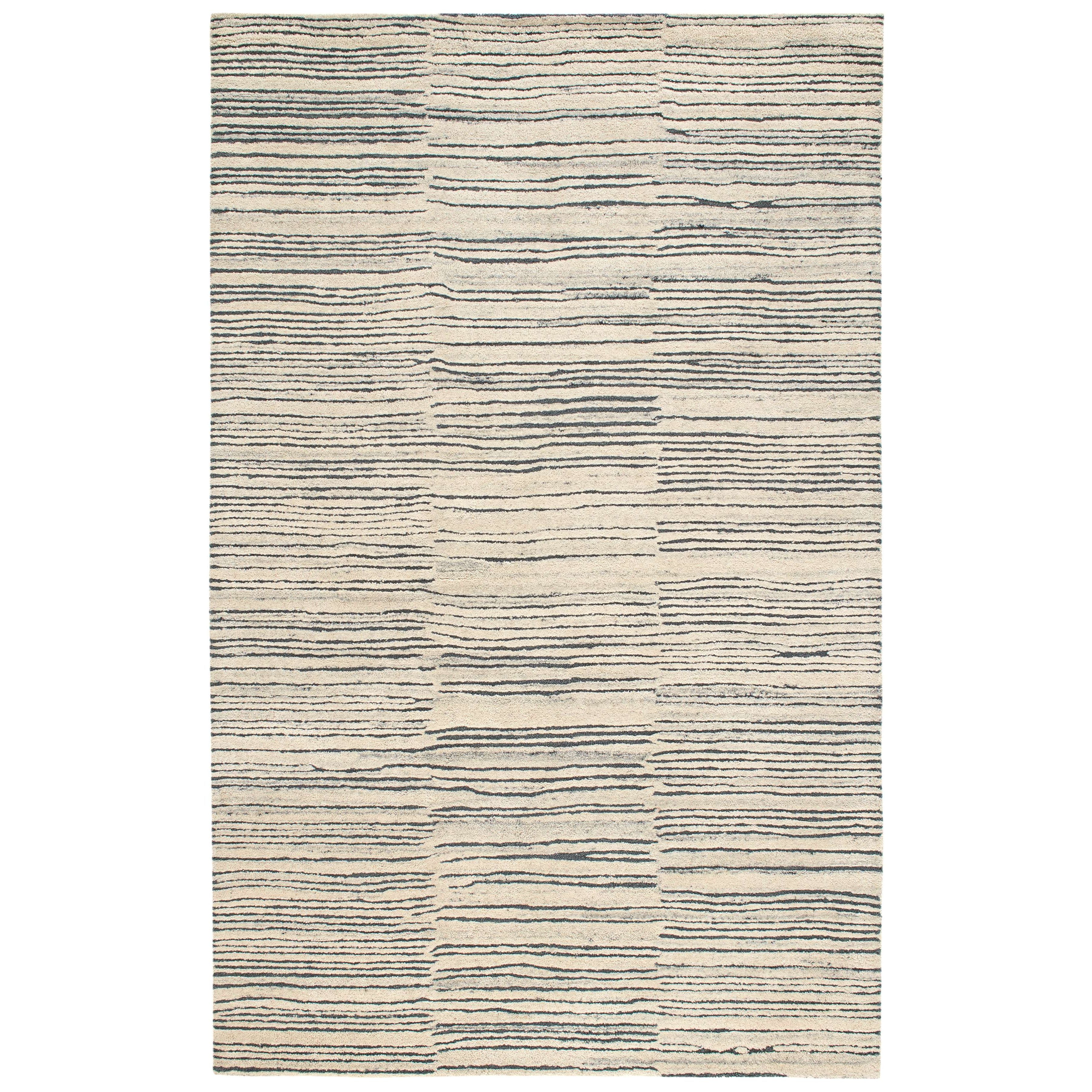 Inspired by substrate layers of sandstone sediments that chronicle the millennia, this luxurious, irregularly striped wool rug will stand the test of time. The subtle degradations of a natural undyed fleece pile enhance the finely observed irregular striping in a softly mineral palette. The subtle beauty of the higher sheared tufts emphasizes the contrast of the densely looped stripes. Amethyst Home provides interior design, new construction, custom furniture, and area rugs in the Kansas City metro area.