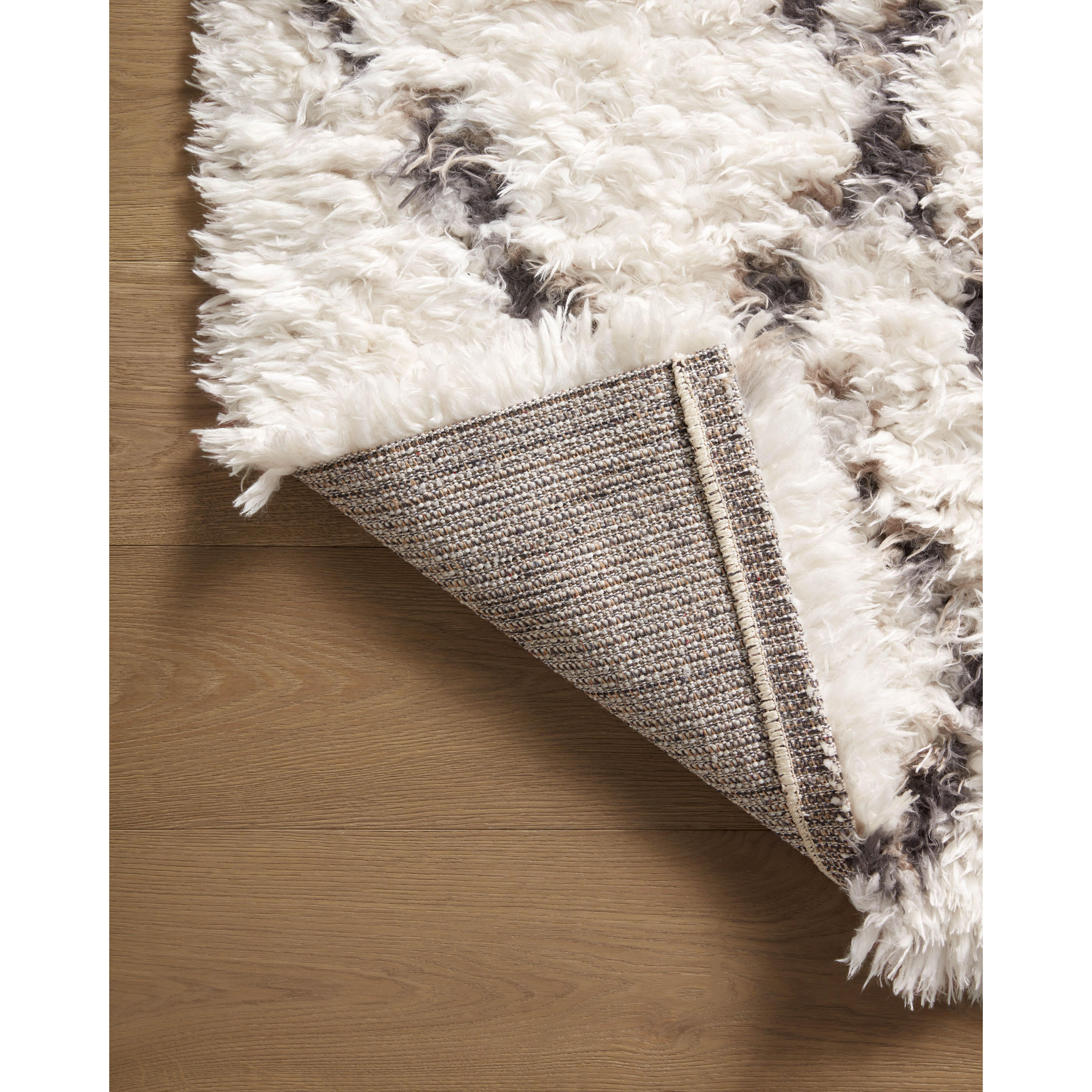 Featuring Angela Rose x Loloi Amira Ivory / Bark Rug by Loloi at Amethyst Home. The extra-plush and inviting Amira Ivory / Bark rug by Angela Rose x Loloi is a Moroccan-inspired area rug with modern geometric patterns (like checkerboard and windowpane) in home-friendly neutral palettes. The rug is power-loomed of 100% polyester and designed to have a soft, high pile that neve. Amethyst Home provides interior design, new construction, custom furniture, and area rugs in the Winter Garden metro area.