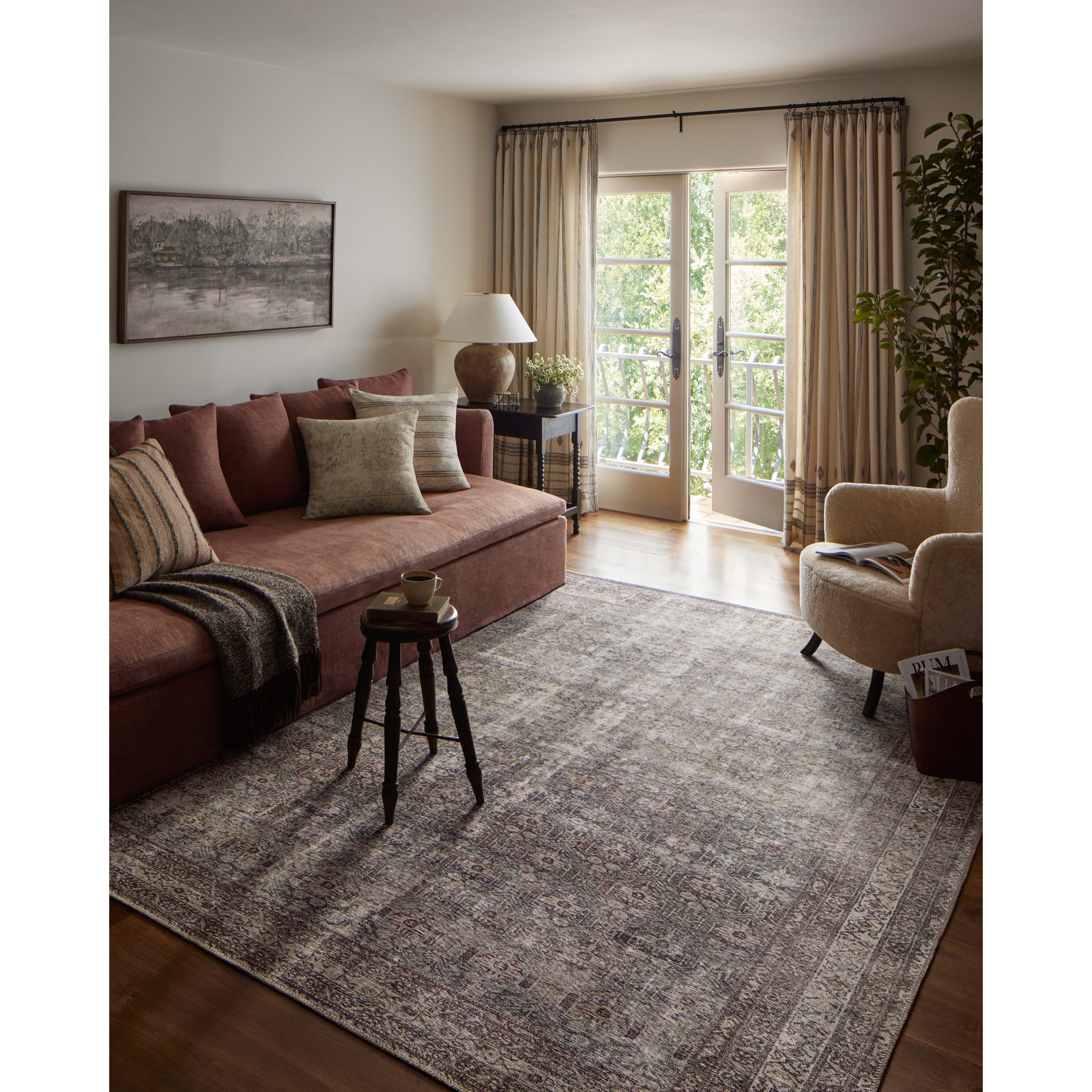 Featuring Amber Lewis x Loloi Georgie Moss / Bark Rug by Loloi at Amethyst Home. Inspired by interior designer Amber Lewis' penchant for vintage rugs, the Georgie Moss / Bark rug features a printed construction with incredible durability, color saturation, and no shedding. The rug's low, flat pile is designed for easy vacuuming and feels smooth underfoot. Georgie also carries the Oe. Amethyst Home provides interior design, new construction, custom furniture, and area rugs in the Dallas metro area.