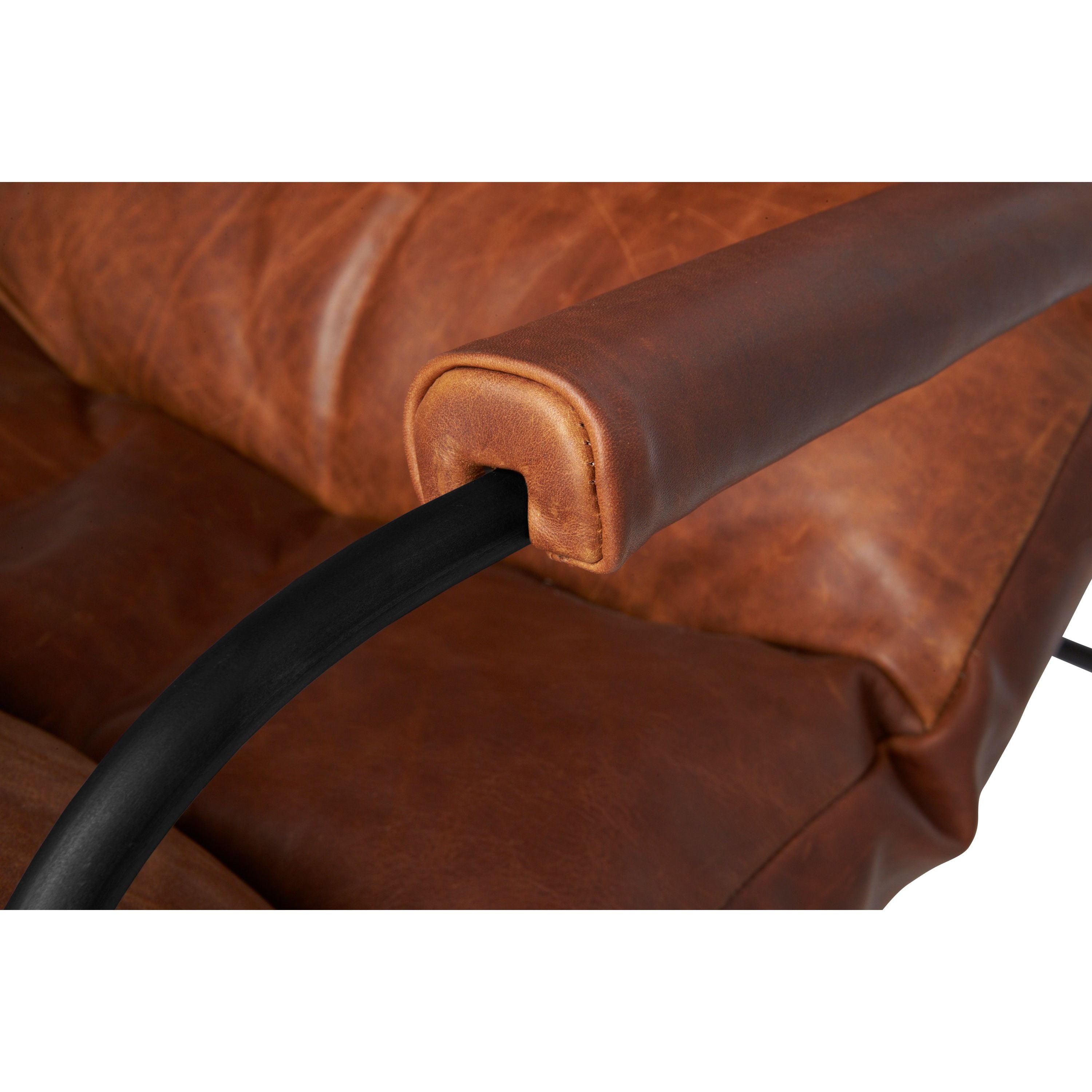 Like "sitting in an American baseball glove" -- the Brando Leather Chair from Cisco Brothers was love at first sit in this unique chair! We compare the feel to sitting in a hammock. As shown in Spur Terracotta leather.  Size: 27"w x 36"d x 32"h  Seat space: 25"w x 19"d x 17.5"h