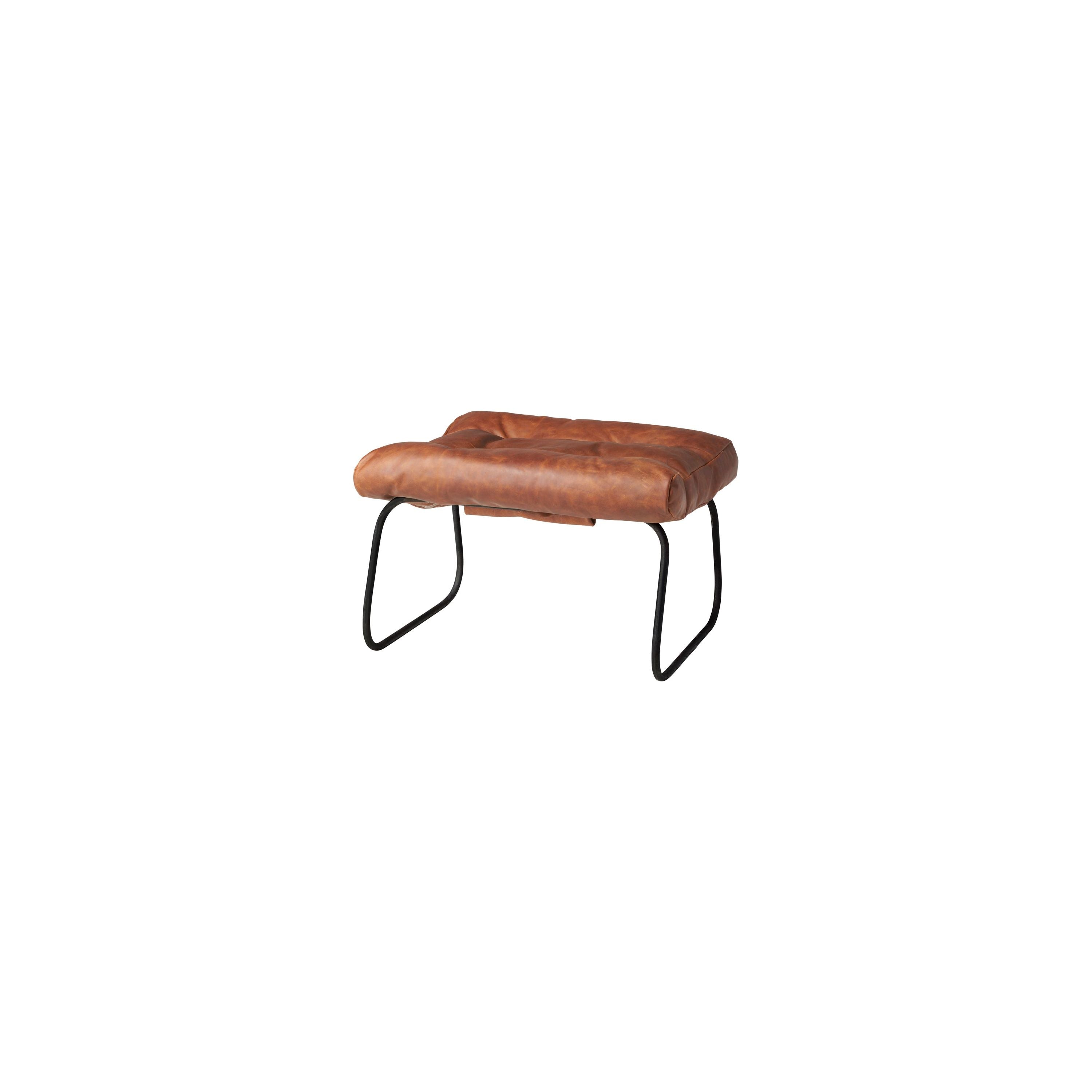 Like "sitting in an American baseball glove" -- the Brando Leather Chair Set from Cisco Brothers was love at first sit in this unique chair! We compare the feel to sitting in a hammock. As shown in Spur Terracotta leather.  Size: 27"w x 36"d x 32"h Seat space: 25"w x 19"d x 17.5"h Ottoman: 25"w x 20"d x 16.5"h