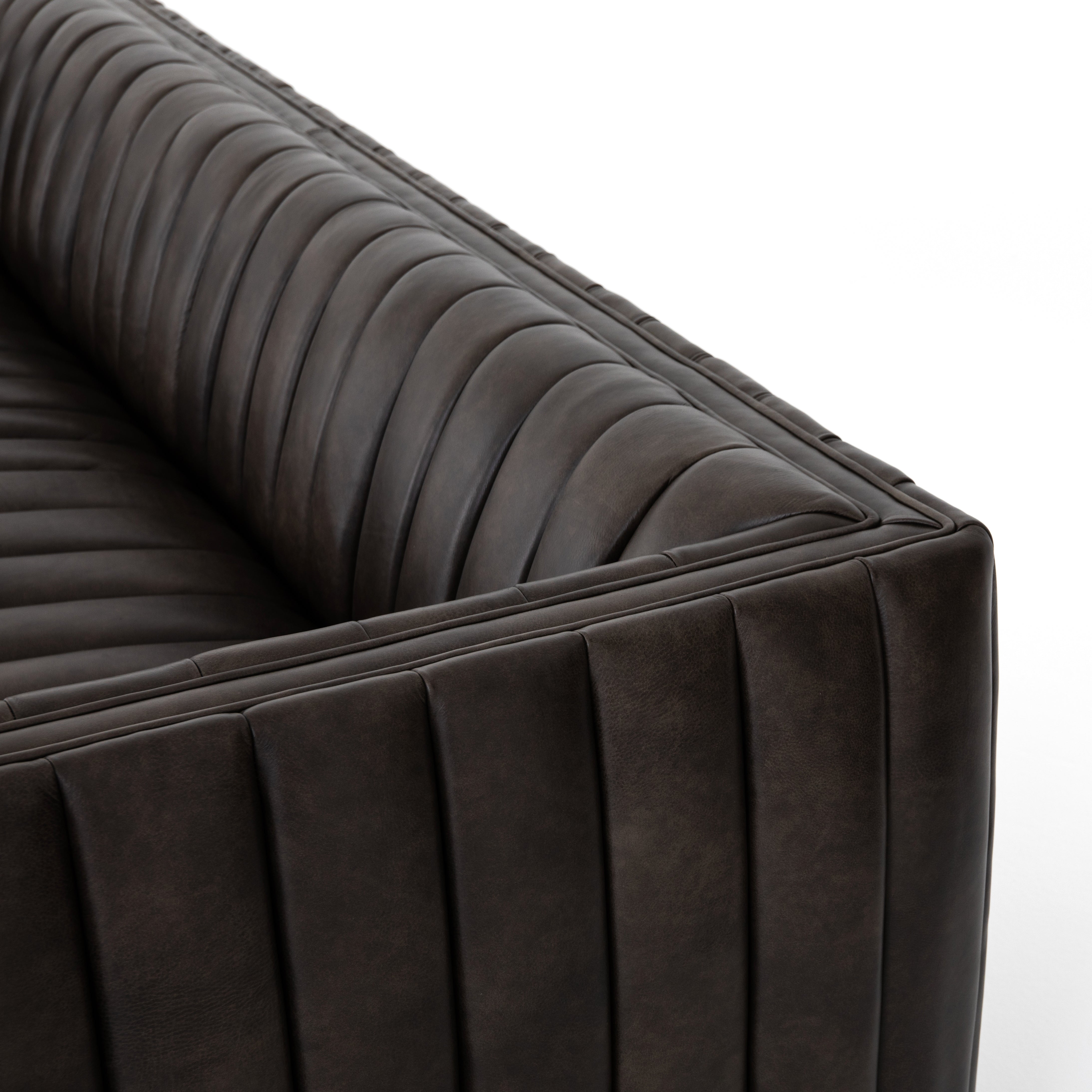 Featuring Henry Wolf Leather Sofa 97" by Four Hands at Amethyst Home. Upholstered in dreamy "wolf" leather -- this sofa is the perfect blend of chocolate and grey tones.  Channeled leather makes for a structured, comfortable sit.  
The Amethyst design team often recommends this sofa when you need a narrower depth without sacrificing comfort.  This sofa sea.  Amethyst Home provides interior design, new home construction design consulting, vintage area rugs, and lighting in the Calabasas metro area.