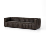 Featuring Henry Wolf Leather Sofa 97" by Four Hands at Amethyst Home. Upholstered in dreamy "wolf" leather -- this sofa is the perfect blend of chocolate and grey tones.  Channeled leather makes for a structured, comfortable sit.  
The Amethyst design team often recommends this sofa when you need a narrower depth without sacrificing comfort.  This sofa sea.  Amethyst Home provides interior design, new home construction design consulting, vintage area rugs, and lighting in the Charlotte metro area.