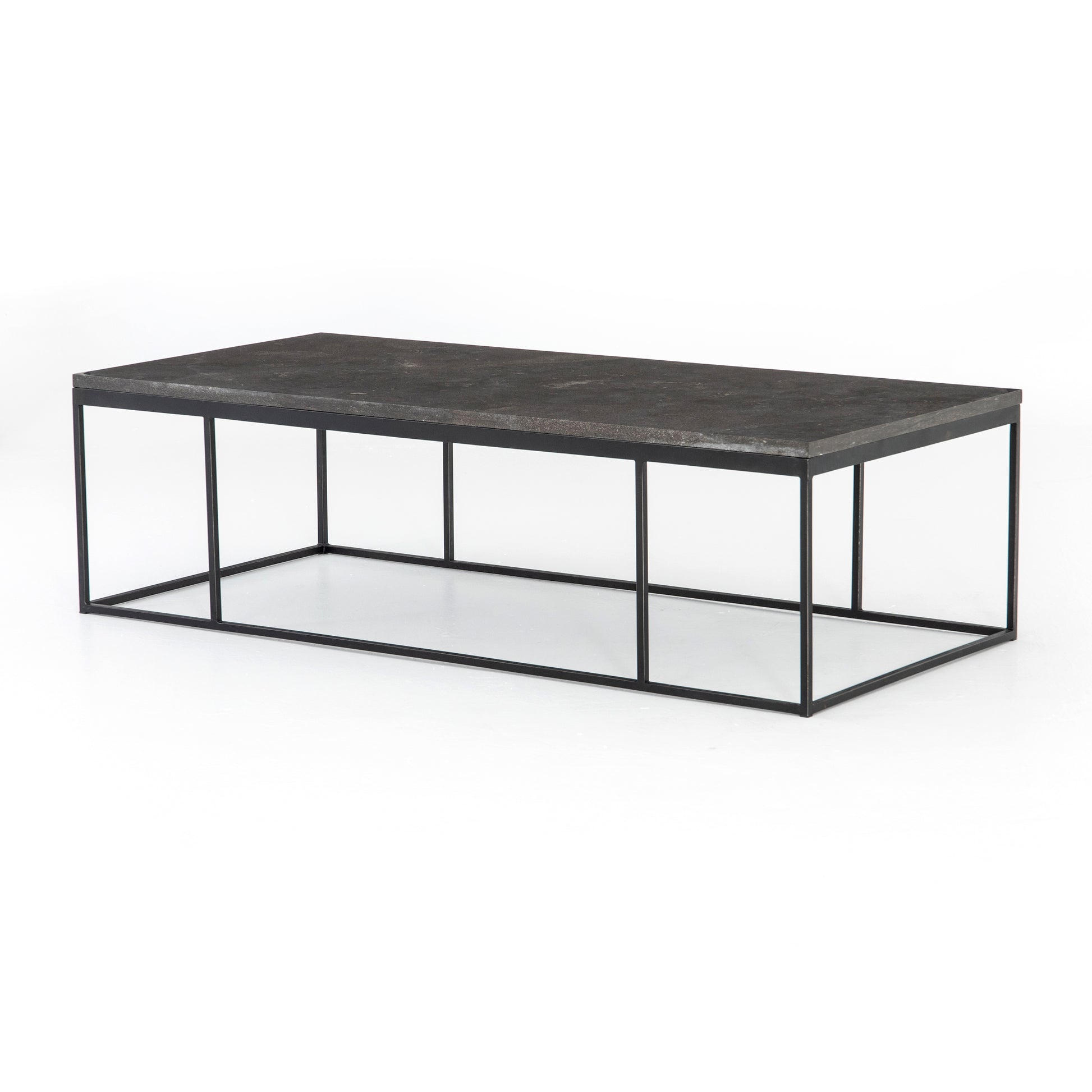 Spare beauty, casual elegance with the Harlow Bluestone Small Coffee Table. A gunmetal Parson's base with hand-rubbed, dimensional edges supports a rough-hewn bluestone slab that feels found and perfectly placed.  Size: 60"w x 28"d x 17"h Materials: Iron, Limestone