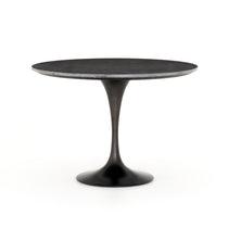 Featuring Powell 55" Dining Table - Bluestone by Four Hands at Amethyst Home. Classic tulip shaping is recast with a rustic black iron finish topped with a solid bluestone table top. This cute bistro style dining table is perfectly sized for a cozy breakfast nook.
Overall Dimensions: 55"W x 55"L x 29.50"H
Colors: Dark Rustic Black, Ebony, BluestoneMaterial.  Amethyst Home provides interior design, new home construction design consulting, vintage area rugs, and lighting in the San Diego metro area.