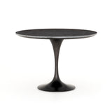 Featuring Powell 55" Dining Table - Bluestone by Four Hands at Amethyst Home. Classic tulip shaping is recast with a rustic black iron finish topped with a solid bluestone table top. This cute bistro style dining table is perfectly sized for a cozy breakfast nook.
Overall Dimensions: 55"W x 55"L x 29.50"H
Colors: Dark Rustic Black, Ebony, BluestoneMateri.  Amethyst Home provides interior design, new home construction design consulting, vintage area rugs, and lighting in the Kansas City metro area.