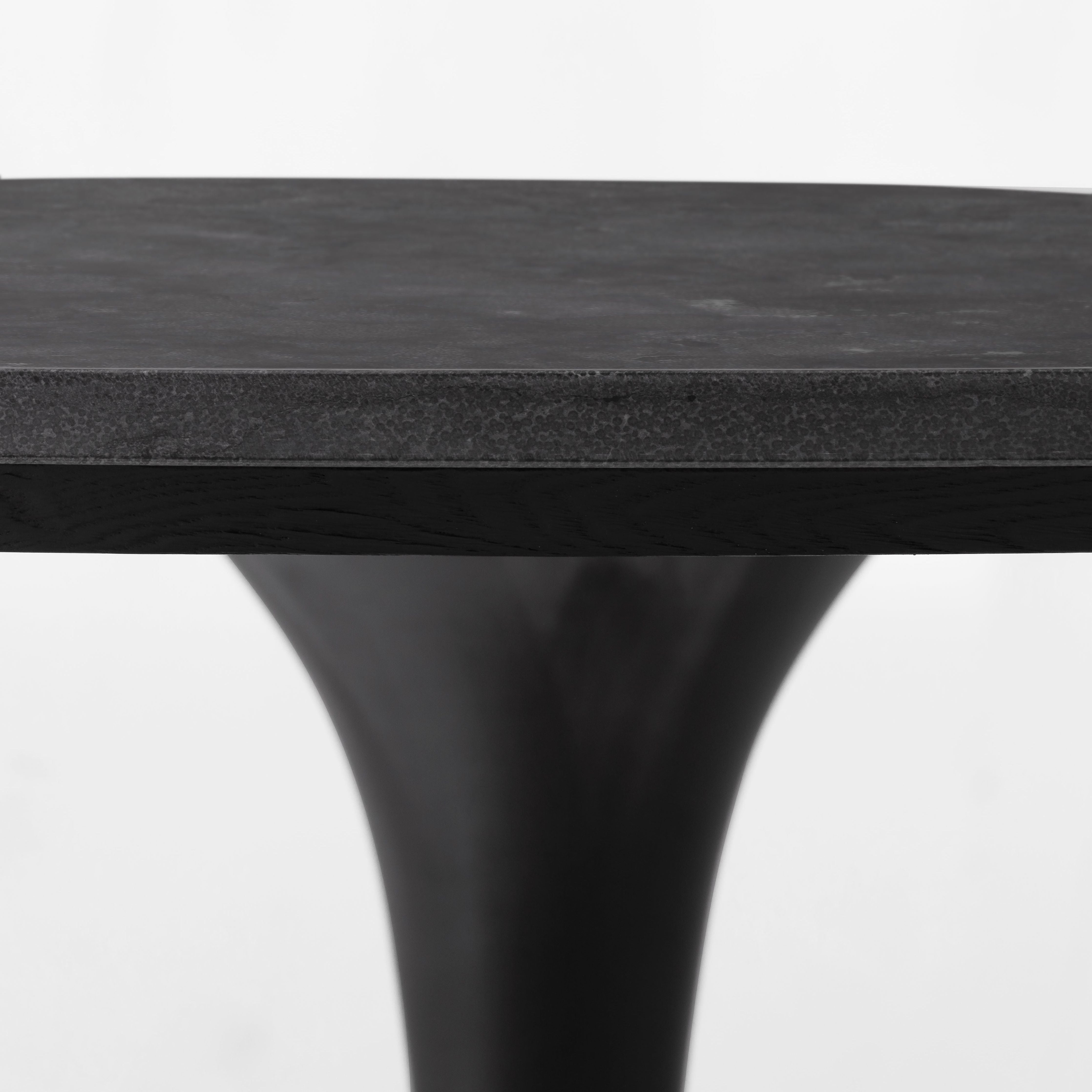 Featuring Powell 55" Dining Table - Bluestone by Four Hands at Amethyst Home. Classic tulip shaping is recast with a rustic black iron finish topped with a solid bluestone table top. This cute bistro style dining table is perfectly sized for a cozy breakfast nook.
Overall Dimensions: 55"W x 55"L x 29.50"H
Colors: Dark Rustic Black, Ebony, BluestoneMaterials: .  Amethyst Home provides interior design, new home construction design consulting, vintage area rugs, and lighting in the Dallas metro area.