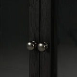 Featuring Spencer Curio Cabinet - Drifted Black by Four Hands at Amethyst Home. We love how the Spencer Drifted Black Curio Cabinet is perched on a simple, waxed black iron pedestal. The rustic black-finished oak forms an airy curio cabinet designed to showcase life’s artifacts.

Overall Dimensions: 45.75"W x 16"L x 69"H
Colors: Drifted Matte Black Veneer.  Amethyst Home provides interior design, new home construction design consulting, vintage area rugs, and lighting in the Washington metro area.