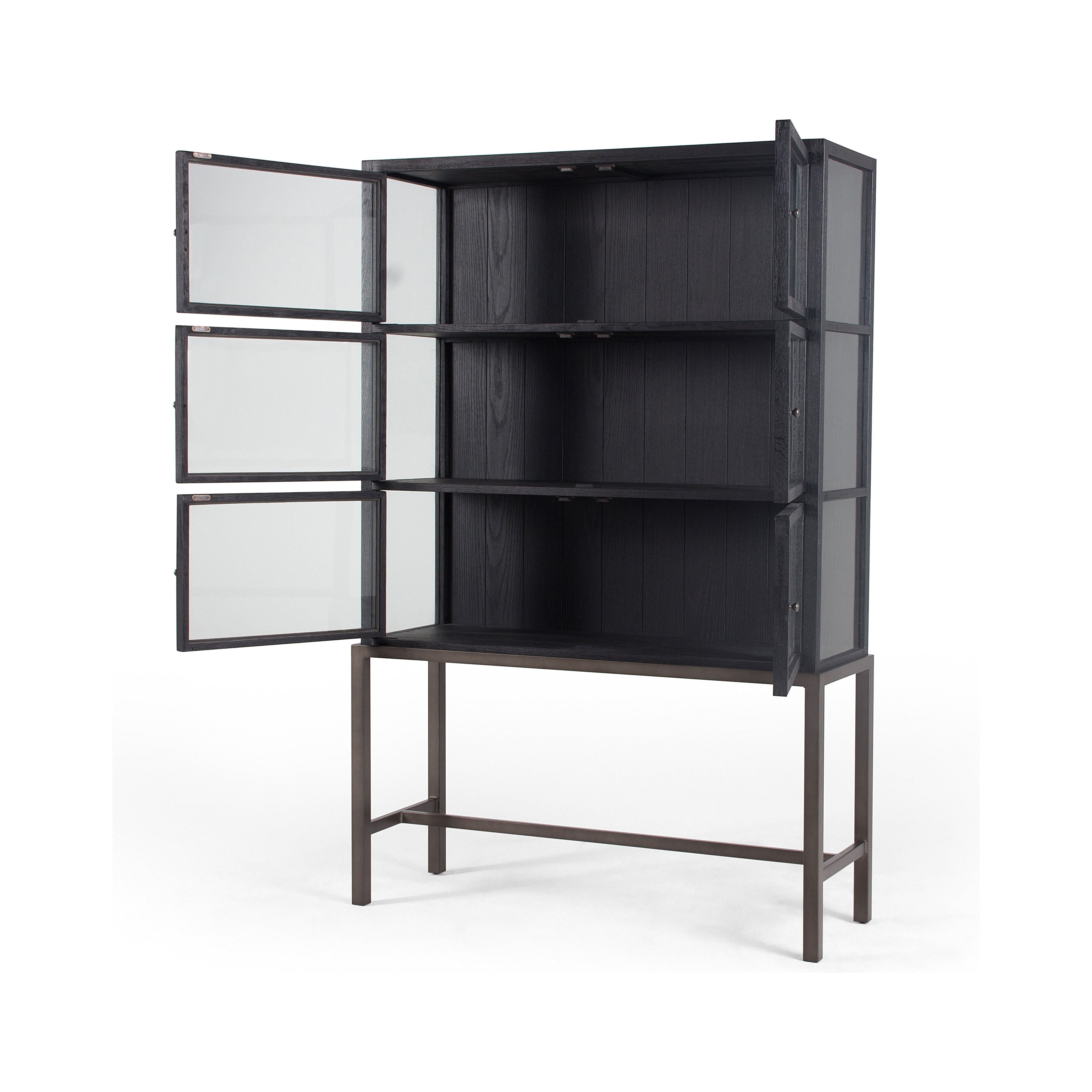 Featuring Spencer Curio Cabinet - Drifted Black by Four Hands at Amethyst Home. We love how the Spencer Drifted Black Curio Cabinet is perched on a simple, waxed black iron pedestal. The rustic black-finished oak forms an airy curio cabinet designed to showcase life’s artifacts.

Overall Dimensions: 45.75"W x 16"L x 69"H
Colors: Drifted Matte Black Veneer.  Amethyst Home provides interior design, new home construction design consulting, vintage area rugs, and lighting in the Scottsdale metro area.