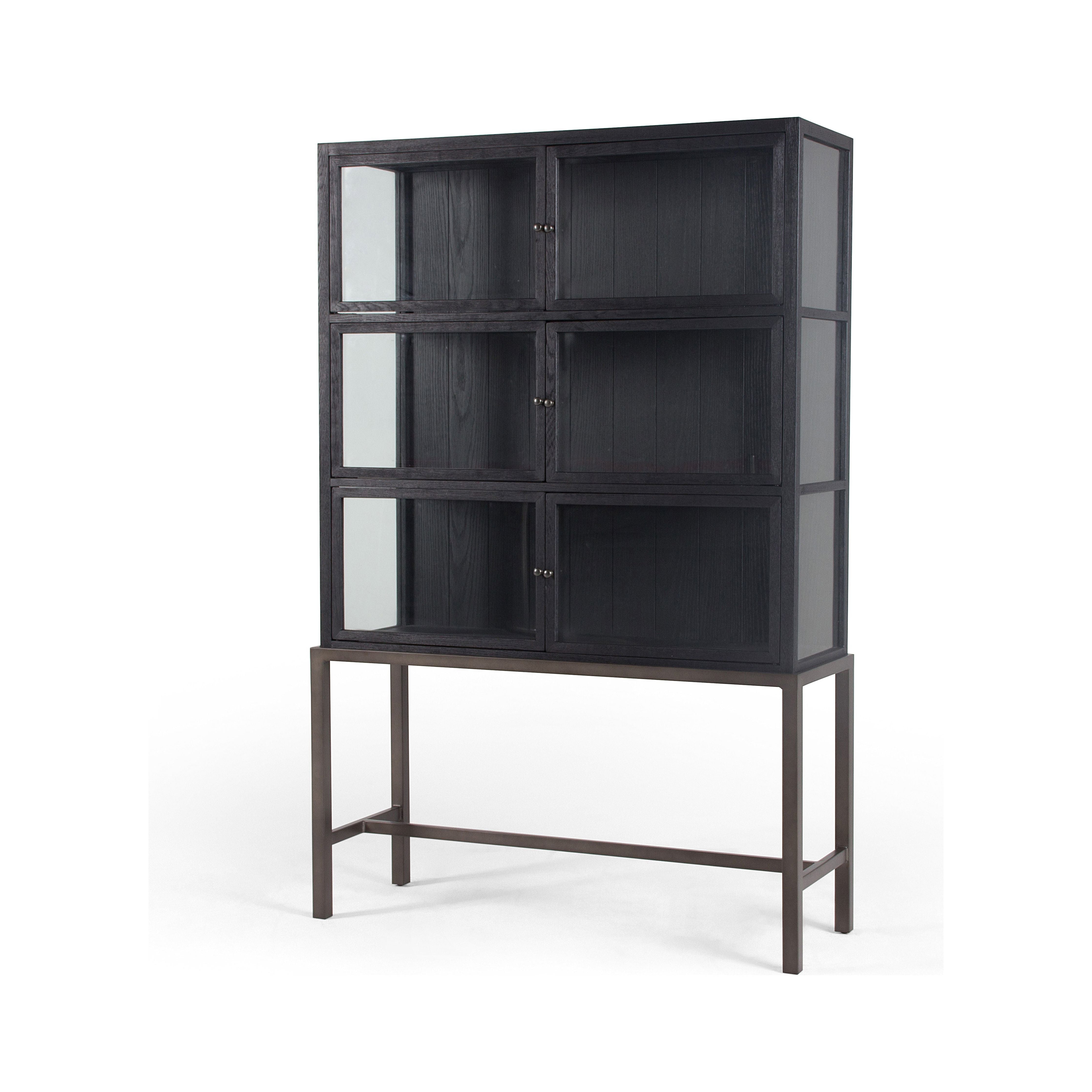 Featuring Spencer Curio Cabinet - Drifted Black by Four Hands at Amethyst Home. We love how the Spencer Drifted Black Curio Cabinet is perched on a simple, waxed black iron pedestal. The rustic black-finished oak forms an airy curio cabinet designed to showcase life’s artifacts.

Overall Dimensions: 45.75"W x 16"L x 69"H
Colors: Drifted Matte Black Veneer, Wax.  Amethyst Home provides interior design, new home construction design consulting, vintage area rugs, and lighting in the Miami metro area.