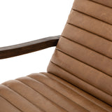 The Chance Recliner has an invitingly curved seat with dramatic horizontal channels is covered in soft, camel-colored top-grain leather. Rich, tonal frame captures alluring negative—and positive—spaces. A push recliner takes this forward-thinking lounger to the next level.  Overall Dimensions: 27.50"w x 56.00"d x 36.00"h Seat Depth: 20.25" Seat Height: 18" Arm Height from Floor: 24" Arm Height from Seat: 6"