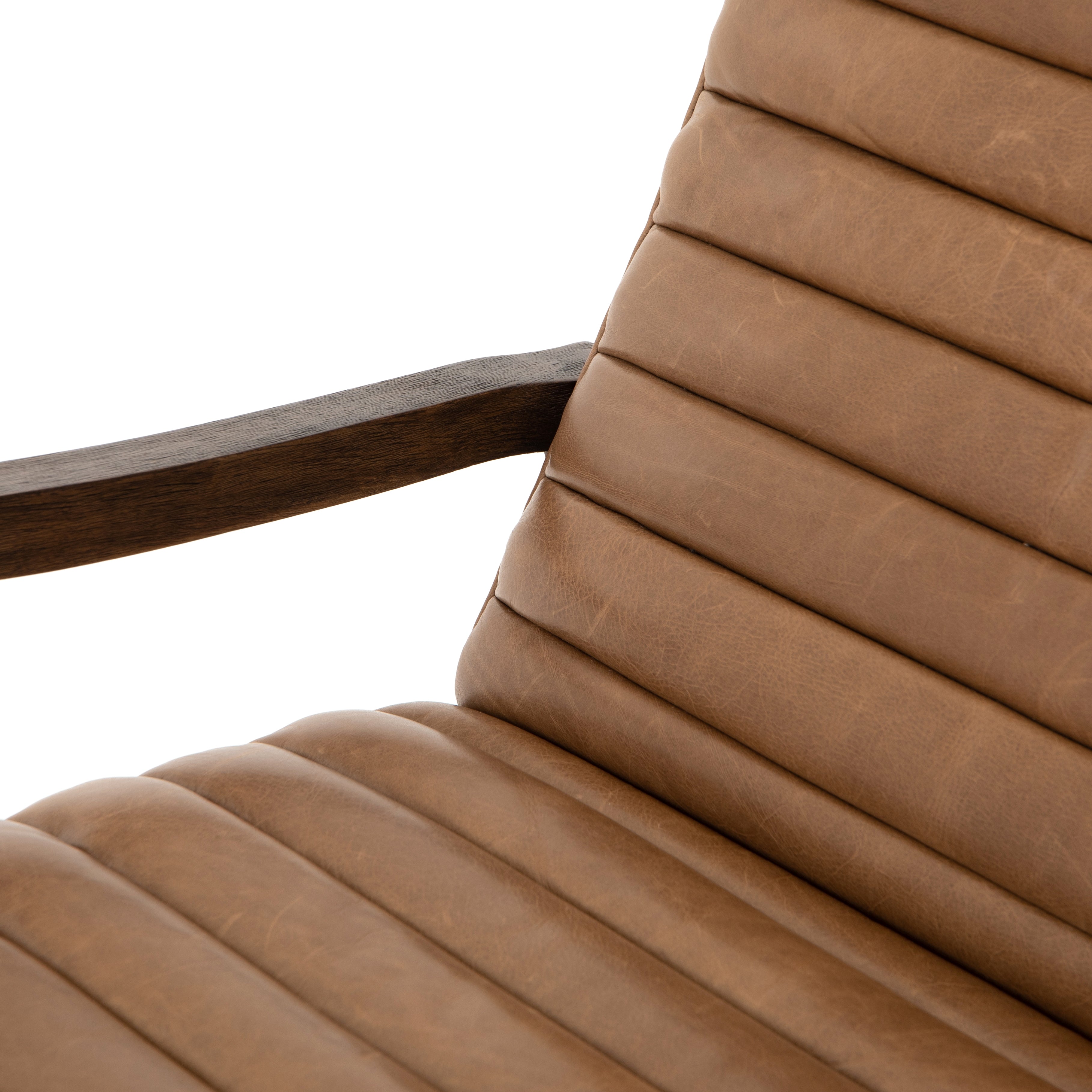 The Chance Recliner has an invitingly curved seat with dramatic horizontal channels is covered in soft, camel-colored top-grain leather. Rich, tonal frame captures alluring negative—and positive—spaces. A push recliner takes this forward-thinking lounger to the next level.  Overall Dimensions: 27.50"w x 56.00"d x 36.00"h Seat Depth: 20.25" Seat Height: 18" Arm Height from Floor: 24" Arm Height from Seat: 6"