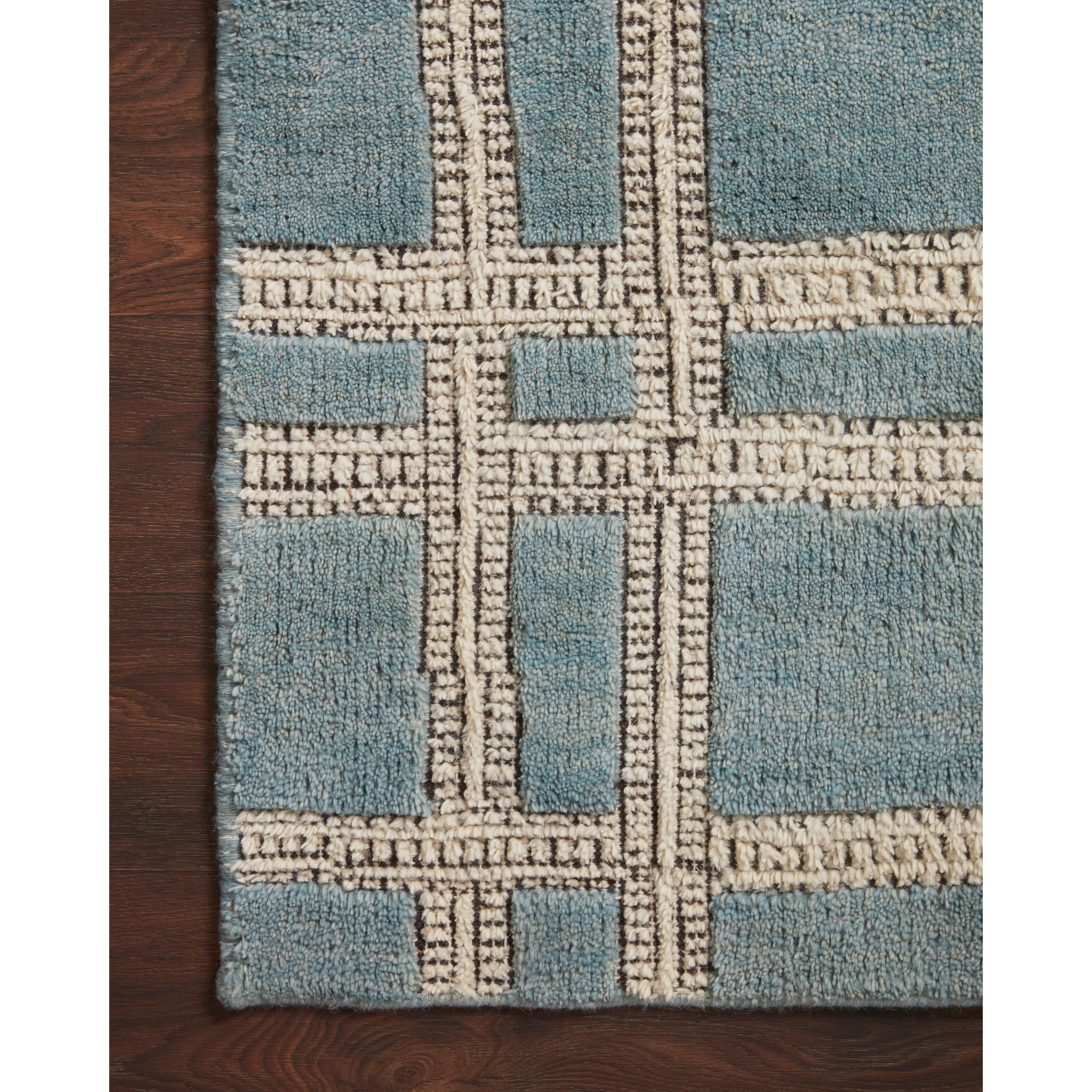 Featuring Carrier & Company x Loloi Milton Ocean / Ivory Rug by Loloi at Amethyst Home. Carrier & Company x Loloi Milton Ocean / Ivory Rug uses a banding detail to express the rich and plush pile. The addition of jute to the wool and cotton rugs creates a luxurious density that can be both seen and felt. As a simple border detail, a graphic plaid, or an o.  Amethyst Home provides interior design, new home construction design consulting, vintage area rugs, and lighting in the Washington metro area.