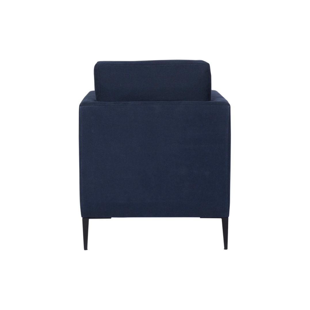 The Benedict Chair - Essentials by Cisco Brothers is a modern design with clean lines and sleek metal legs in black rust. It has a fresh and functional aesthetic with no-sag support. As a small scale sofa, its ideal for apartment living and suitable for any occasion. Photographed in Mariet Marine.   Overall: 27.5"w x 30"d x 28"h