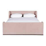 We love the maple wood base of this Laurel Bed by Cisco Brothers. A cosy, chic piece to add to your bedroom to immediately elevate the space. Photographed in Molino Blush.   Queen: 65"w x 84.5"d x 31.5"h King: 81"w x 31"h x 85"d California King: 77"w x 31"h x 89"d