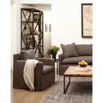 Featuring Louis Mini Chair - Essentials by Cisco Brothers at Amethyst Home. The Louis Chair by Cisco Brothers has an engaging profile and a sheltering, narrow seat. This design combines modern and coastal aesthetics with clean lines, a straight skirt, and a subtle 2" slit. A classic style with a scale that suits any living room or lounge area. Photographed.  Amethyst Home provides interior design, new home construction design consulting, vintage area rugs, and lighting in the San Diego metro area.