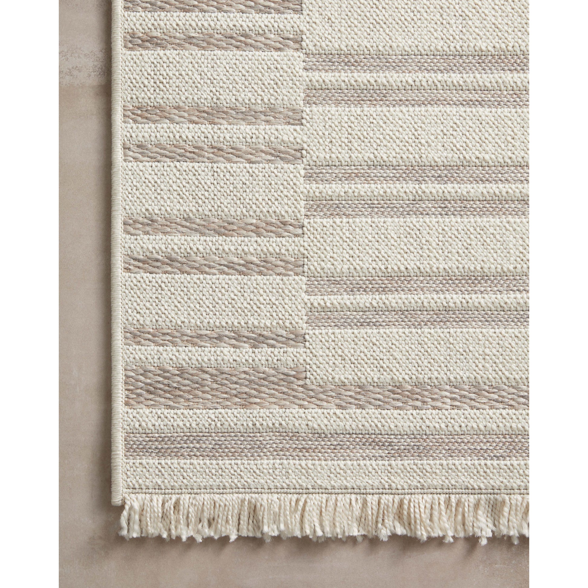 The Malibu Collection is an indoor/outdoor area rug by Amber Lewis x Loloi that channels the casual modern vibe of the beach city it’s named after. The rug’s neutral-toned geometric prints are easy to match with a range of decor styles, while a hint of fringe adds to the breezy aesthetic. Amethyst Home provides interior design, new construction, custom furniture, and area rugs in the Seattle metro area.