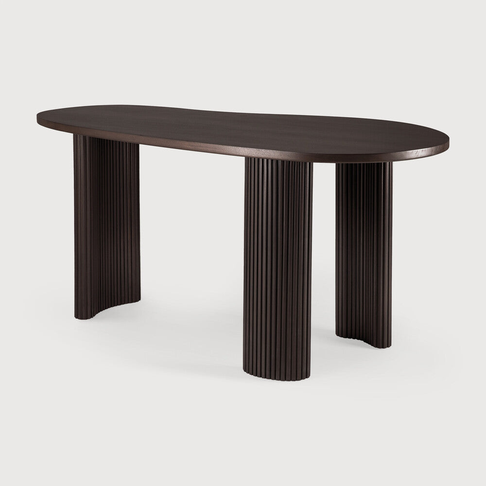 Featuring Boomerang Mahogany Dark Brown Desk by Ethnicraft at Amethyst Home. Inspired by shapes found in nature, the Boomerang collection features a playful, pebble top set on curved legs with a stacked, wood stick effect. The Boomerang desk is a statement piece for any workspace with its organic, eye-catching design unique for the office.
Dimensions: 33"d x 63. Amethyst Home provides interior design, new home construction design consulting, vintage area rugs, and lighting in the Omaha metro area.